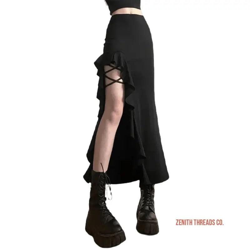 Black ruffled skirt with lace-up side detail and combat boots.