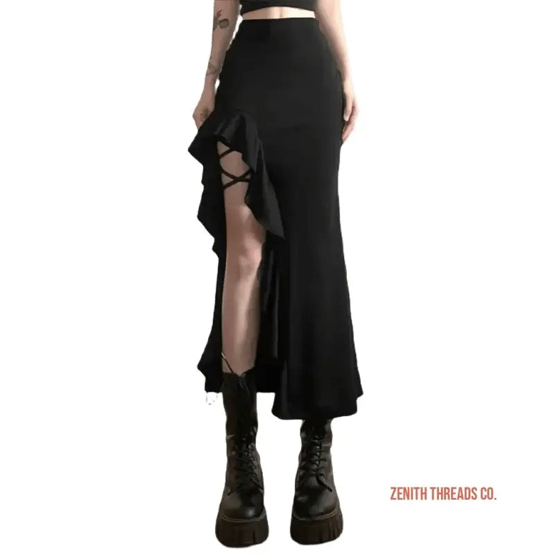 Black ruffled maxi skirt with side slit and criss-cross detailing worn with combat boots.