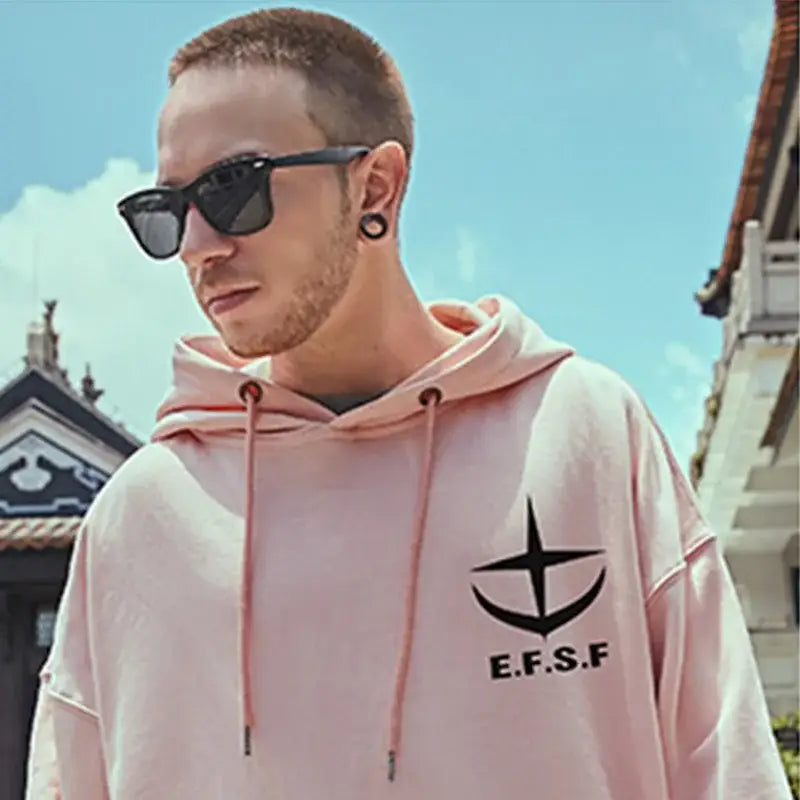 Pink hoodie with ’E.F.S.F’ logo and black sunglasses.