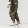 Olive green linen pants paired with a Timeless Chinese style jacket inspired by Tang Dynasty fashion