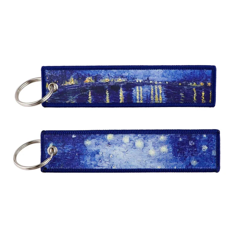 Two zinc alloy keychains featuring Japanese waves embroidered Van Gogh paintings