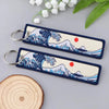 Japanese waves embroidered zinc alloy keychain set featuring wave and mountain designs