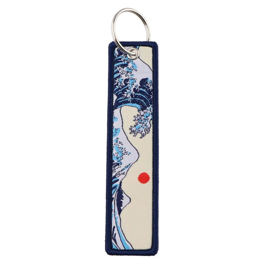 Rectangular zinc alloy keychain featuring Japanese waves embroidered design