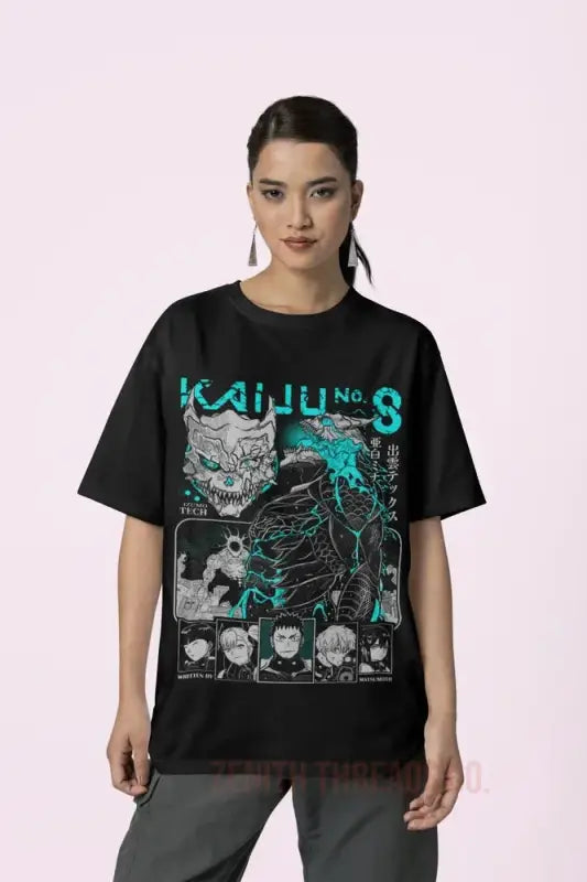 Black t-shirt featuring a teal kaiju monster design with Japanese-style graphics and text.