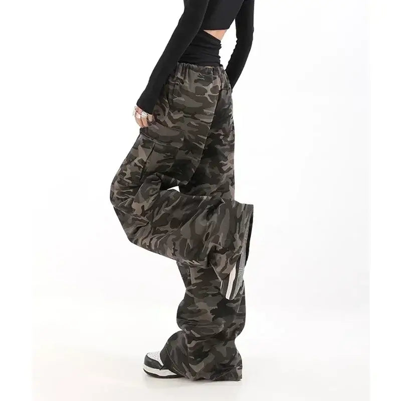 Camouflage cargo pants with wide legs and multiple pockets.