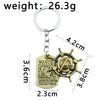 One Piece keychain featuring wanted poster and ship wheel for anime streetwear enthusiasts