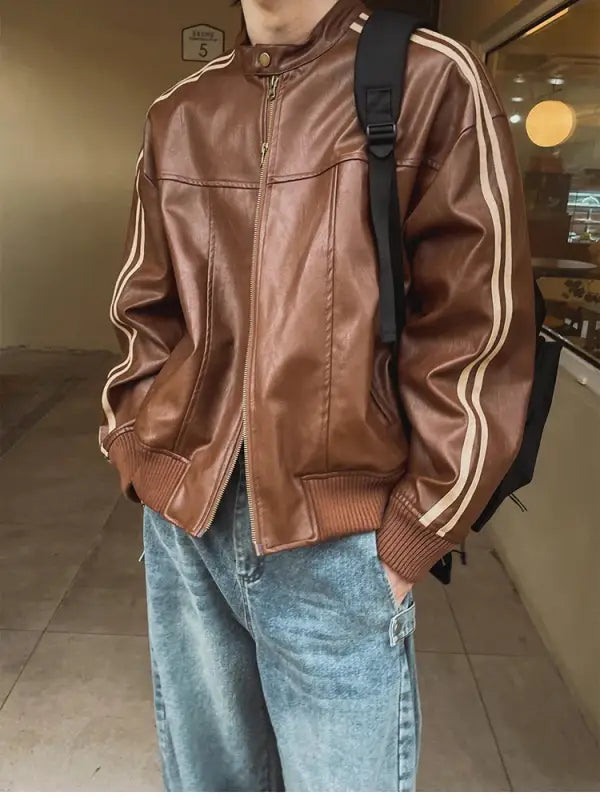 Brown leather jacket with white racing stripes on the sleeves.