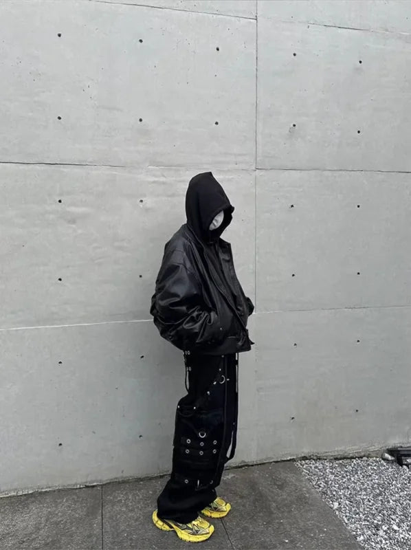 Person in black hooded jacket and baggy pants wearing Mauroicardi oversized black thickened leather bomber