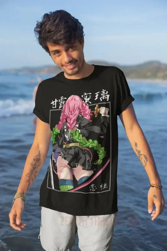 Black graphic t-shirt featuring pink and green anime-style artwork with Japanese text.