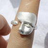 Silver Masked Faces Ring with Adjustable Open-Band and Elegant Metal Finish