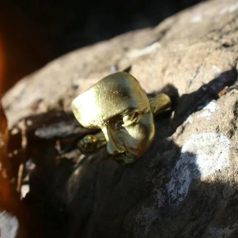 Golden face ring showcasing the Mystical Masked Faces adjustable open-band with metal finish