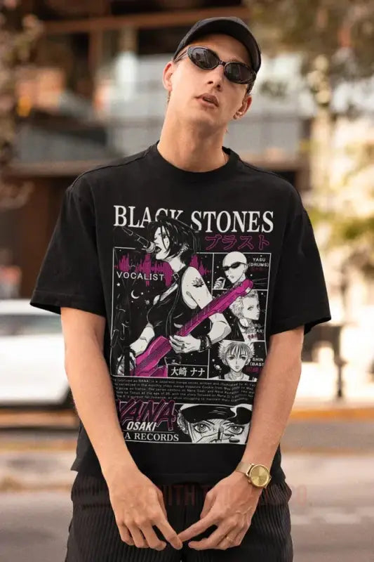 Black graphic t-shirt featuring ’Black Stones’ band artwork with pink and white designs.