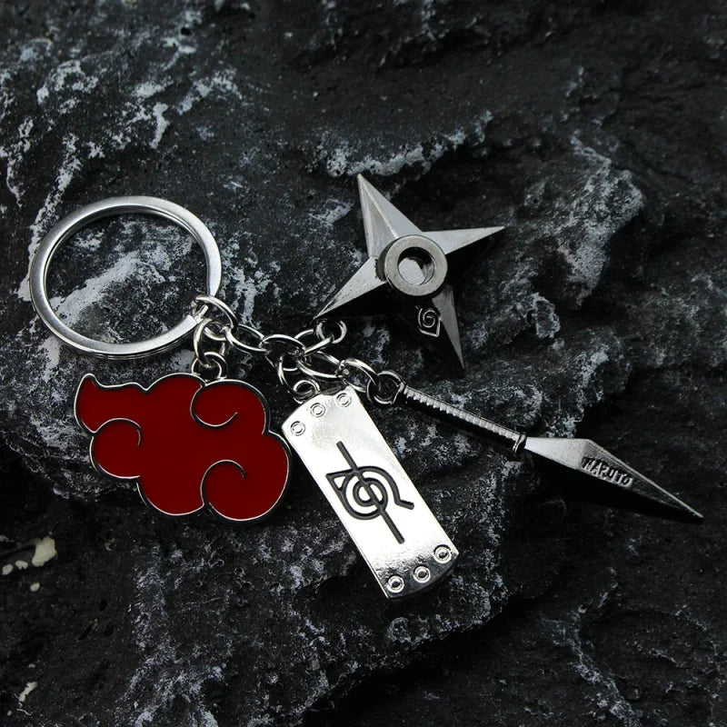 Naruto anime metal keychain featuring cloud, headband, shuriken, and kunai charms