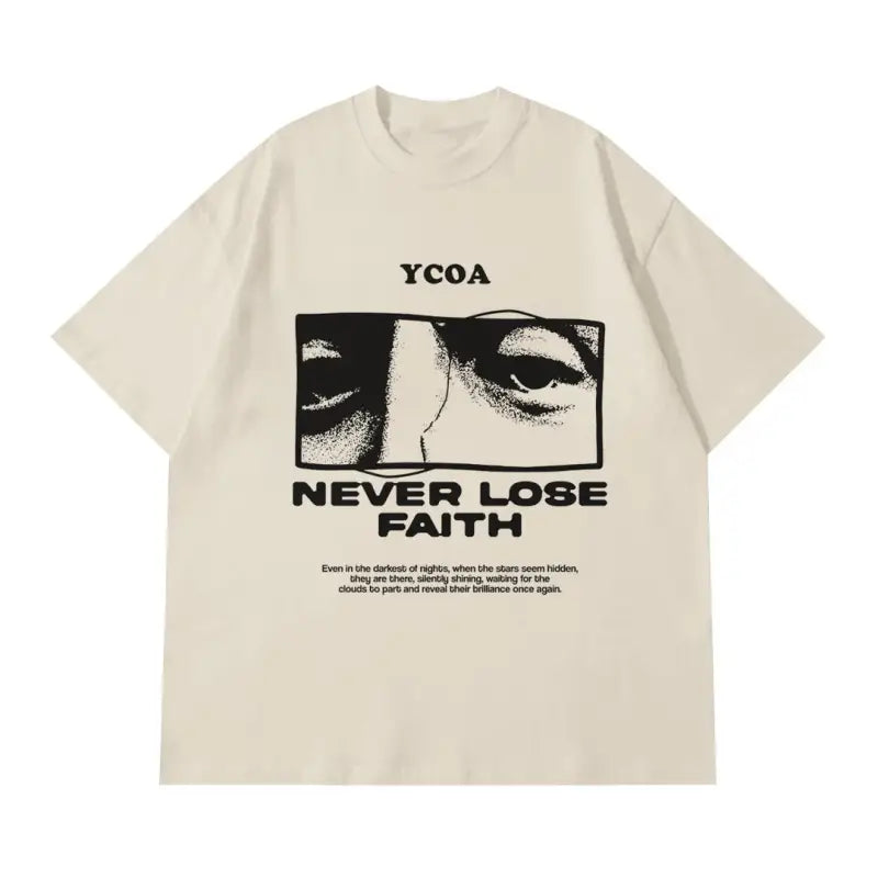 Cream-colored t-shirt with ’NEVER LOSE FAITH’ text and a black graphic showing eyes.