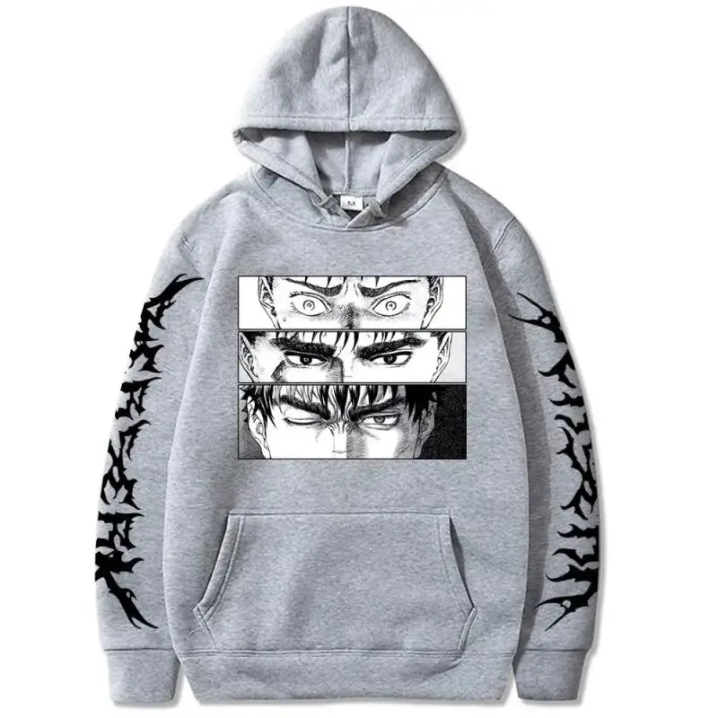 Grey hoodie featuring manga-style eye illustrations and black tribal sleeve designs.