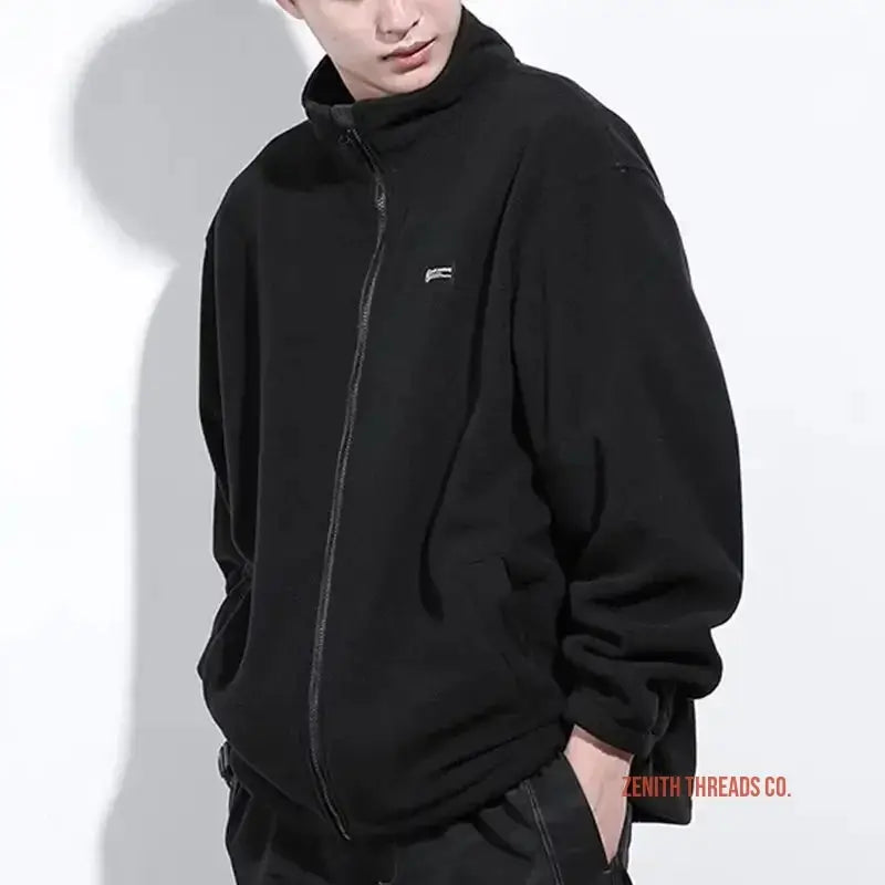 Black zip-up fleece jacket with a small logo on the chest.