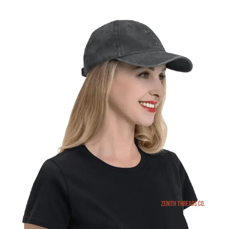 Black baseball cap worn with a black t-shirt.