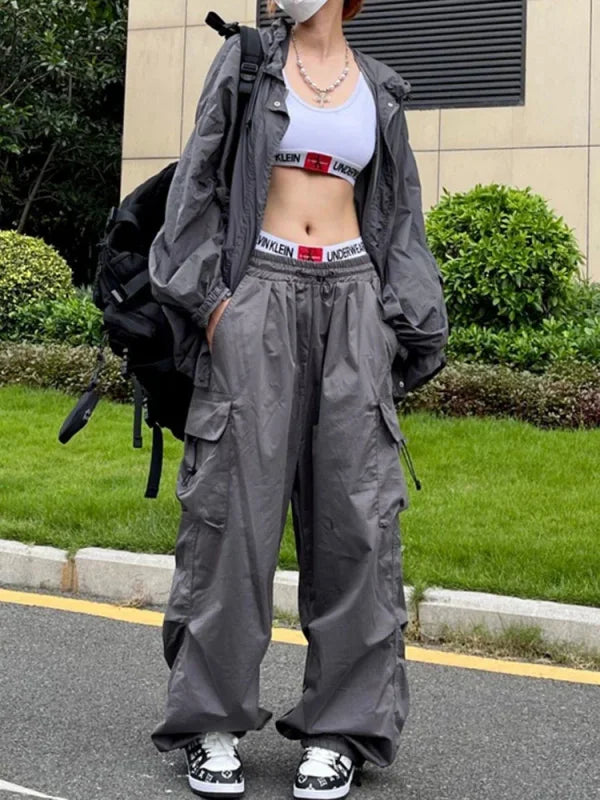 Gray baggy cargo pants in durable polyester for y2k streetwear with parachute black cargo style