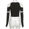 Black long-sleeved crop top with shoulder cutouts and slight stretch in gothic patchwork design