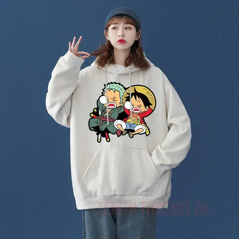 White hoodie sweatshirt featuring One Piece anime characters Zoro and Luffy in cartoon style.