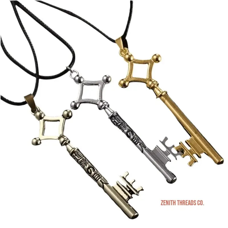 Decorative key-shaped pendant necklaces in gold and silver metallic finishes.