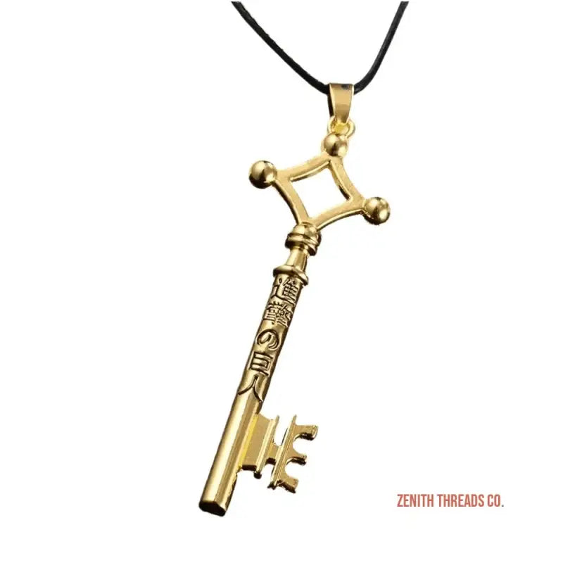 Gold-colored ornate skeleton key pendant on a black cord.