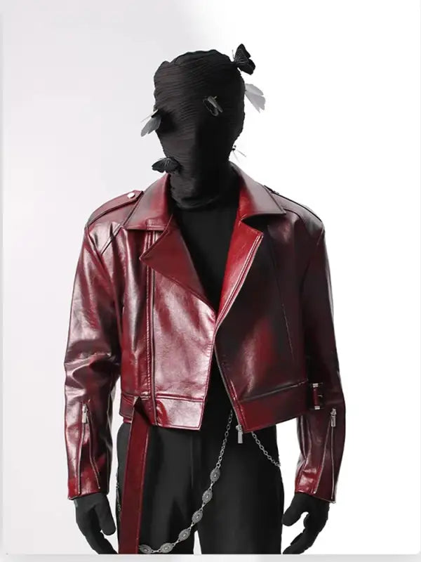 Metallic burgundy leather motorcycle jacket with silver zippers and a cropped cut.