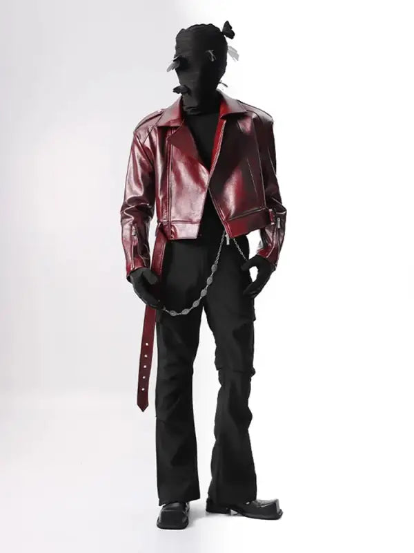 Red leather motorcycle jacket paired with black pants in a standing pose.