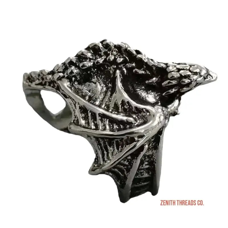 Gothic-style dragon ring with textured scales and wing details in silver or pewter metal.