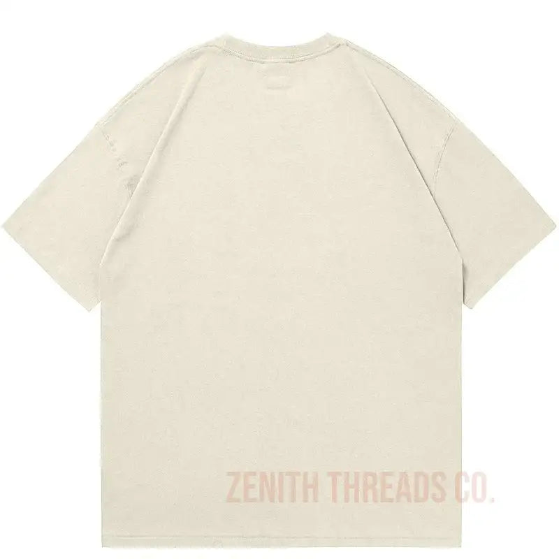 Beige t-shirt with ’Zenith Threads Co.’ text on the lower back.