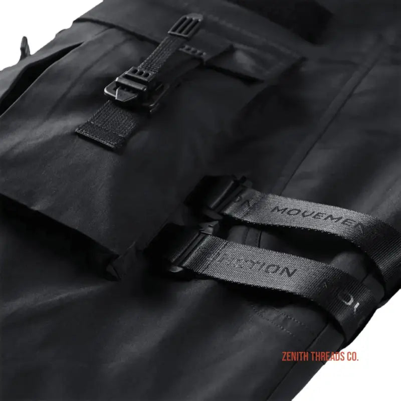 Black tactical backpack with buckle straps and ’MODEME’ branding.