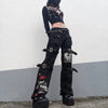 Black cargo pants featuring buckles and graphic prints for techwear gothic low style