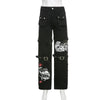 Techwear gothic low waist black cargo pants with buckles featuring a striking graphic print