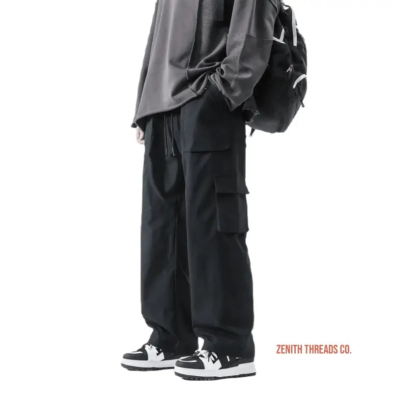 Black cargo pants with multiple pockets and a loose, relaxed fit.