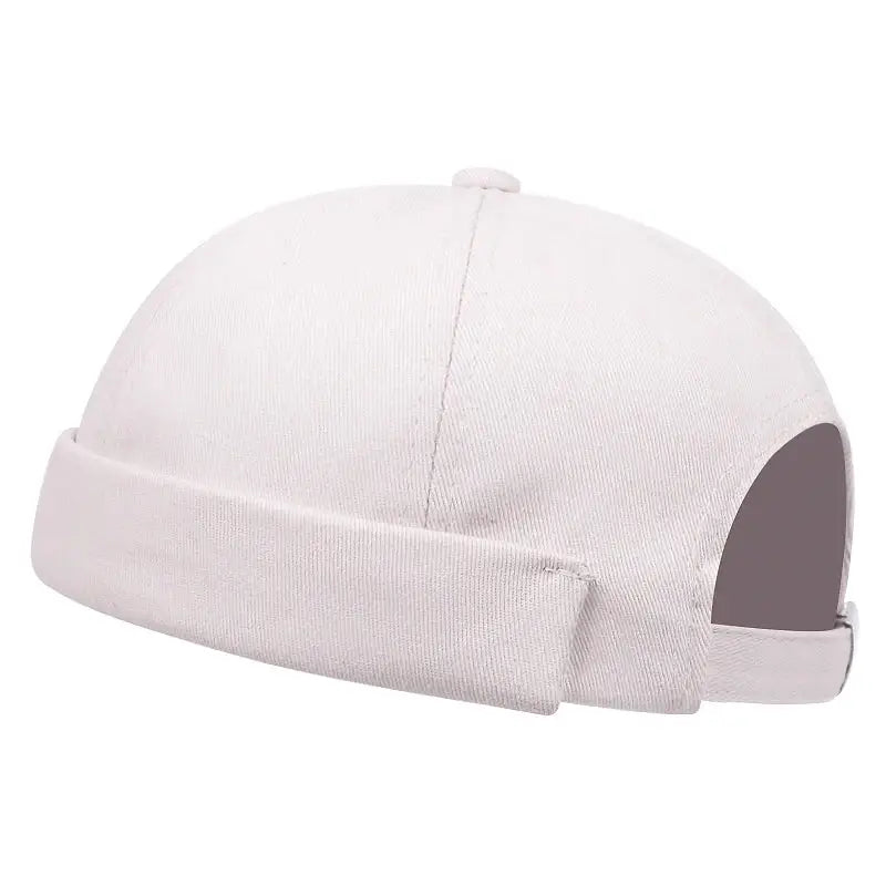 White cotton docker cap with a rolled brim.