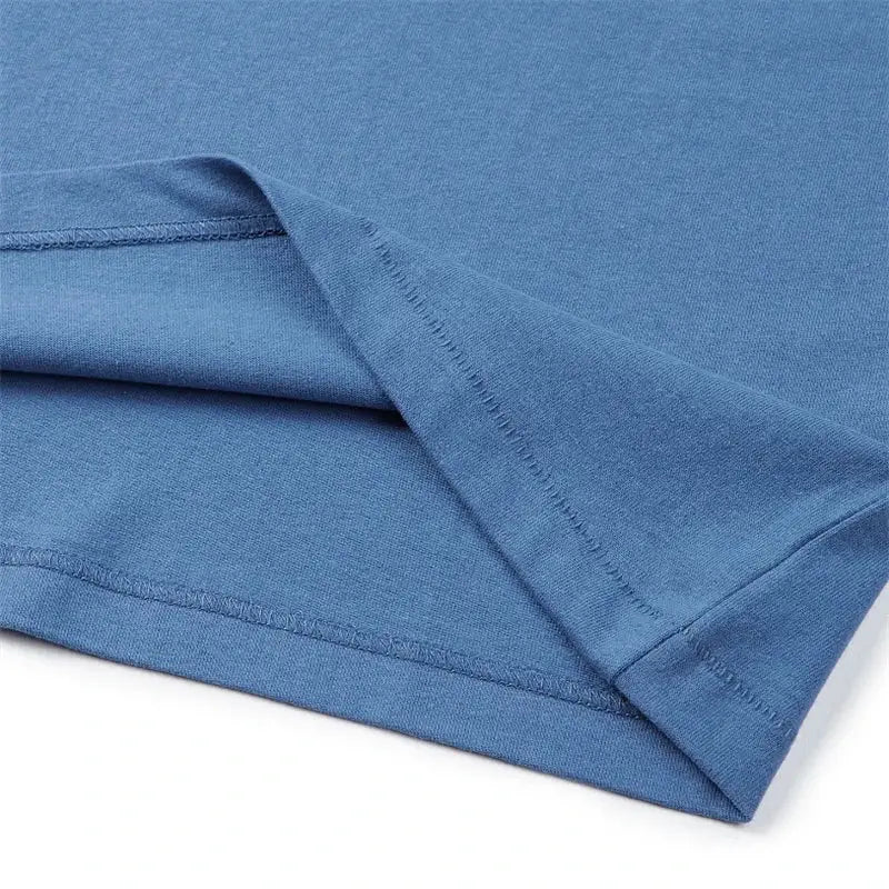 Folded blue fabric with visible stitched seams.