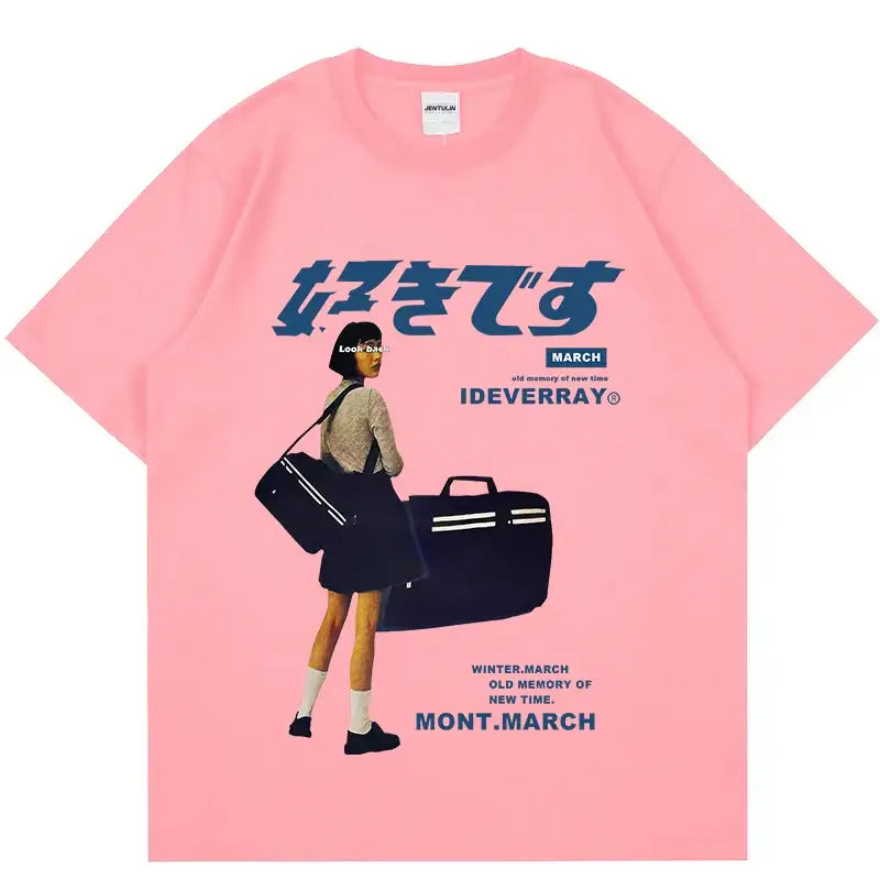 Pink t-shirt featuring Japanese text and retro-style artwork of a figure with luggage.