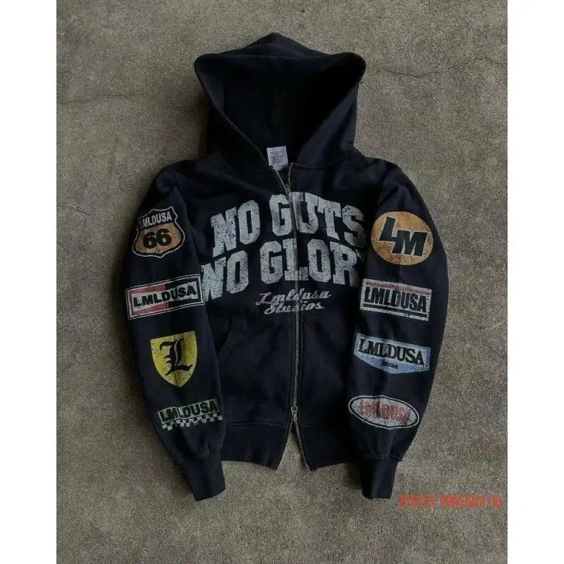 Black zip-up hoodie with various patches and ’No Guts No Glory’ text.