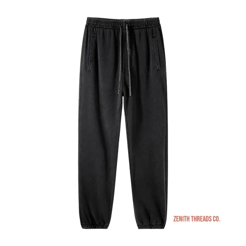 Black sweatpants with elastic cuffs and drawstring waist.