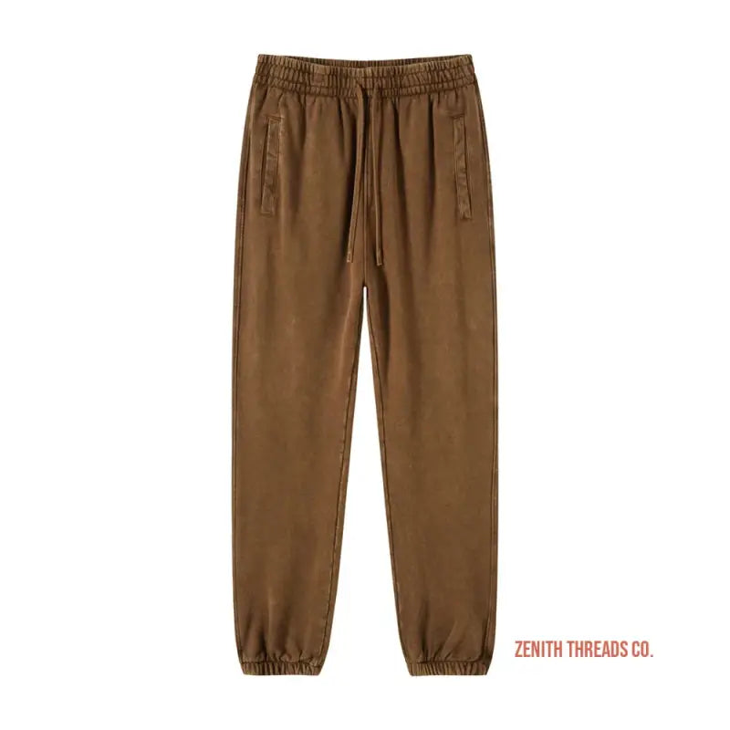 Brown elastic-waist jogger pants with side pockets.