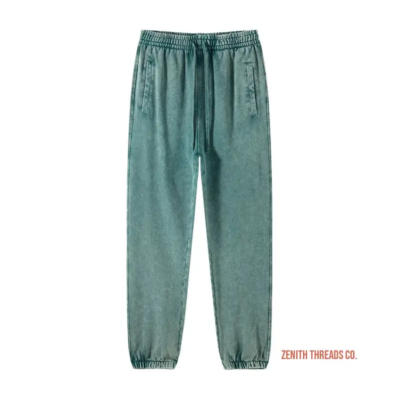 Sage green jogger sweatpants with elastic waistband and cuffs.