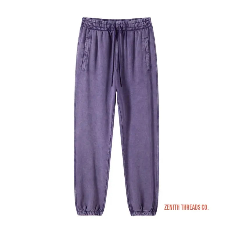 Purple drawstring jogger pants with elastic cuffs.