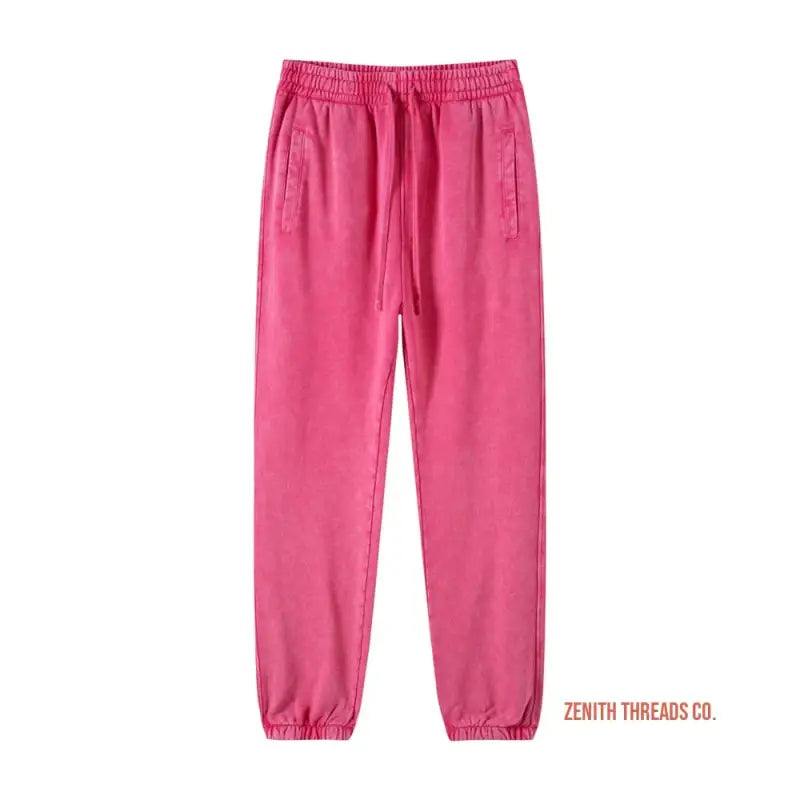 Pink elastic-waist sweatpants with side pockets and gathered ankle cuffs.