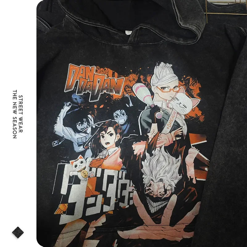 Black hoodie featuring Dandadan anime characters in a vintage washed design