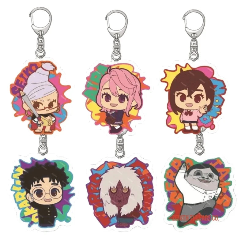 Set of colorful anime-style character keychains with decorative backgrounds.