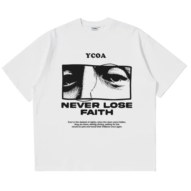 White t-shirt with black graphic design showing eyes and text reading ’NEVER LOSE FAITH’