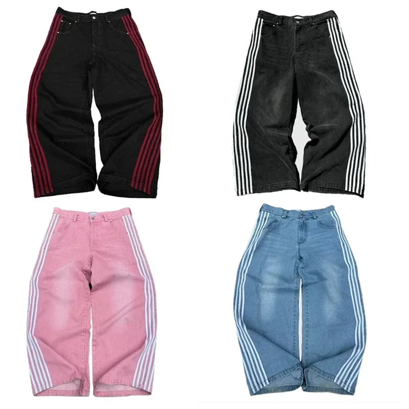 Four pairs of wide-leg track pants with striped side panels in black, pink, and blue colors.