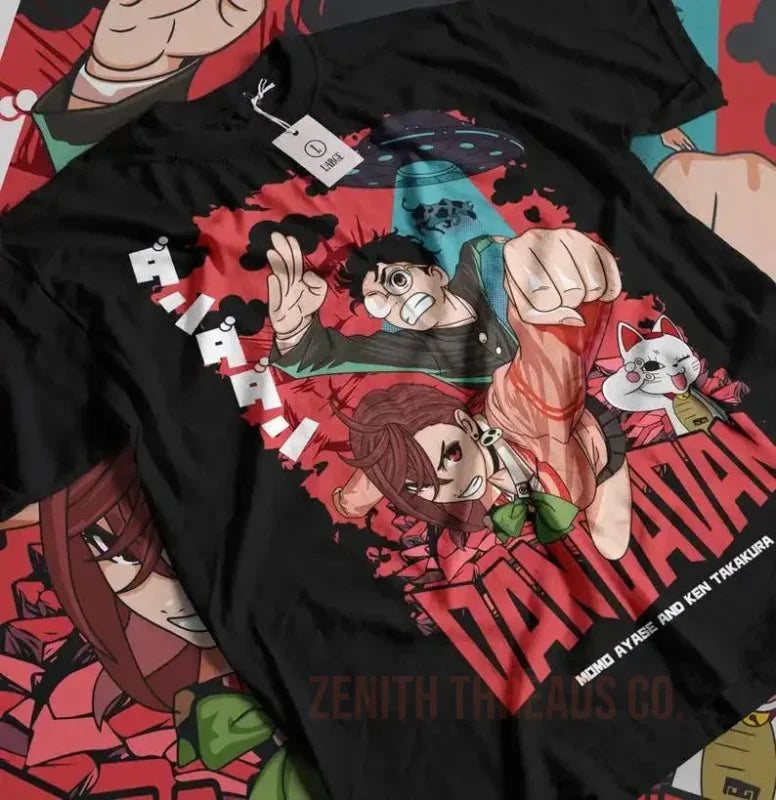 Black t-shirt featuring anime-style artwork with characters in dynamic action poses against red splatter effects.