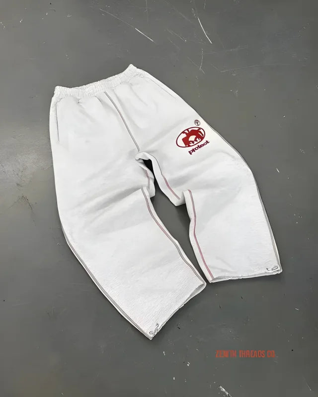 Gray sweatpants with a red logo patch on the side.