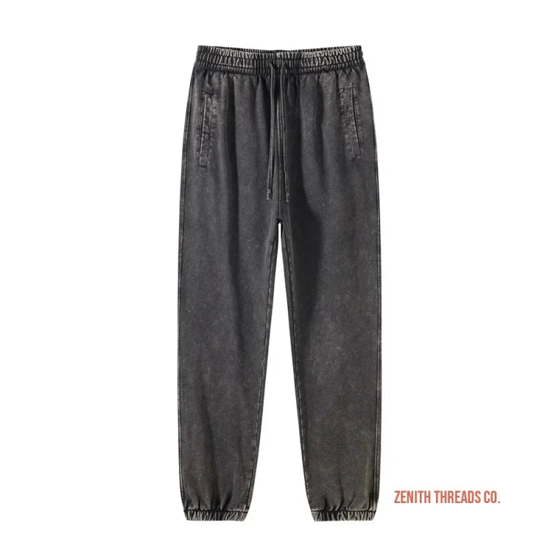 Dark gray jogger pants with elastic cuffs and drawstring waist.